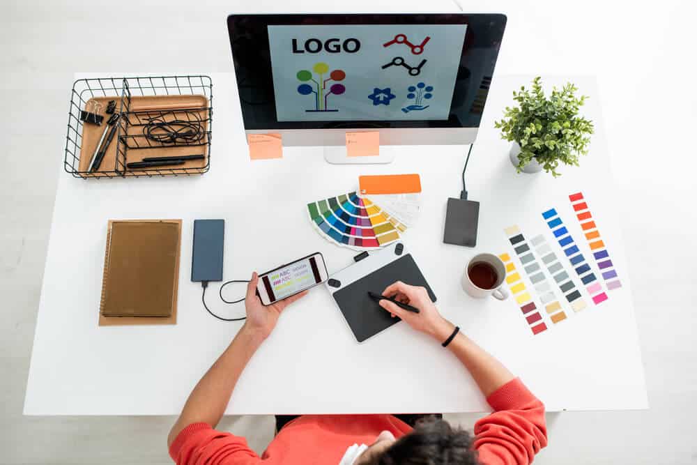 Flat layout of young web designer with stylus and graph - Big Easy SEO